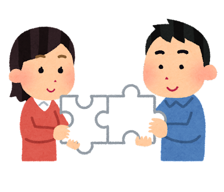 パズルをはめている男女のイラスト